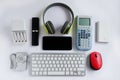 Smartphone with Headphones and Scientific calculator and other electronic gadgets on White background, Reuse and Recycle concept, Royalty Free Stock Photo