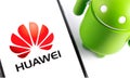 Smartphone with Huawei logo and Android figure