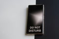 Smartphone with the inscription do not disturb on a two-tone black and white background. Concept of exhaustion, fatigue,