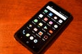 Smartphone Laying On Wood Table Showing Popular Apps And Socials On Display Screen, Editorial