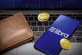 Smartphone with Libra logo on the screen and Libra Cryptocurrency digital golden coins with wallet on notebook, Libra blockchain Royalty Free Stock Photo