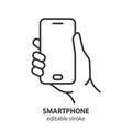 Smartphone line icon. Mobile phone in hand outline vector symbol. Editable stroke