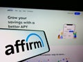 Smartphone with logo of American fintech company Affirm Holdings Inc. on screen in front of website.