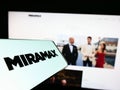 Smartphone with logo of American television production company Miramax LLC on screen in front of website. Royalty Free Stock Photo