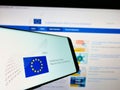 Smartphone with logo of authority European Data Protection Supervisor (EDPS) on screen in front of website.