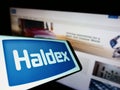 Smartphone with logo of automotive company Haldex Europe SAS on screen in front of business website. Royalty Free Stock Photo