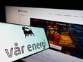 Smartphone with logo of Norwegian oil and gas company Var Energi on screen in front of website. Royalty Free Stock Photo