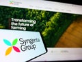 Smartphone with logo of Swiss agriculture company Syngenta Group on screen in front of business website. Royalty Free Stock Photo