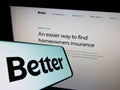 Smartphone with logo of US financial company Better Mortgage (Better.com) on screen in front of website.