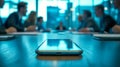 Smartphone lying on conference table during business meeting Royalty Free Stock Photo