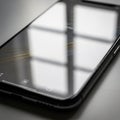 A smartphone lying flat on a Royalty Free Stock Photo
