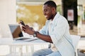 Man sitting black internet technology happy mobile male smartphone phone adult young lifestyle african Royalty Free Stock Photo