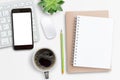 Smartphone,mini keyboard,mouse and notebook on white office desk background Royalty Free Stock Photo