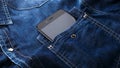 Smartphone mobile in Blue jeans shirt pocket with black screen Royalty Free Stock Photo