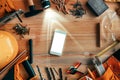 Smartphone mock up on carpentry woodwork workshop desk
