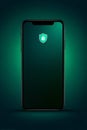Smartphone mock up with green glowing background and security shield icon, showcasing modern technology and digital Royalty Free Stock Photo