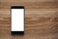 Smartphone with Mockup image white screen On Wooden Table Royalty Free Stock Photo