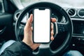 Smartphone mockup screen, male driver using mobile phone in car on cold winter day Royalty Free Stock Photo