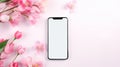 Smartphone mockup screen on pink pastel flowers background. Mockup mobile phone blank empty display flower shop app Royalty Free Stock Photo