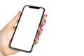 Smartphone mockup in woman hand. New modern black frameless smartphone mockup with blank white screen. Isolated on white backgroun Royalty Free Stock Photo