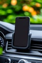 A cell phone is sitting in the center console of a car Royalty Free Stock Photo