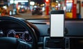 Smartphone mounted in car dashboard at night with blurred gas station background Royalty Free Stock Photo