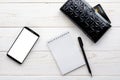 Smartphone, notebook, pen and credit card on a white table Royalty Free Stock Photo