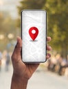 Smartphone With Opened Gps App With Red Pinpoint In Black Female Hand Royalty Free Stock Photo