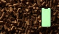 Smartphone over a lot of wine corks. Top view. 3D rendering Royalty Free Stock Photo