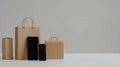 smartphone paper bags and giftbox on isolated background with copyspace, Online shopping concept