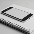 Smartphone placed on a spiral-bound notebook with lined paper Royalty Free Stock Photo