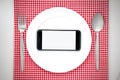 Smartphone on plate Royalty Free Stock Photo