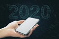 Smartphone and polygonal text 2020 New Year Royalty Free Stock Photo