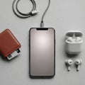 Smartphone with a reflective screen is connected to a braided USB cable Royalty Free Stock Photo