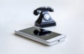 Smartphone and retro telephone Royalty Free Stock Photo