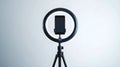 Smartphone on ring light tripod studio setup Royalty Free Stock Photo