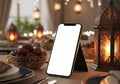 Smartphone screen blank on table with dates and lanterns Royalty Free Stock Photo