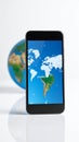 Smartphone Screen Showing South America Map with Earth Globe on White Background Royalty Free Stock Photo