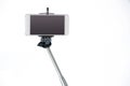 Smartphone on a selfie stick Royalty Free Stock Photo