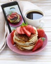 Smartphone shot food photo - pancakes for breakfast with strawberries