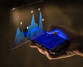 Smartphone showing data analysis hologram