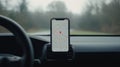 Smartphone showing navigation map on car dashboard