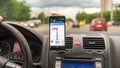 Smartphone showing Waze maps to show the way thru the city