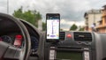 Smartphone showing Waze maps to show the way thru the city