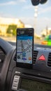 Smartphone showing Waze maps to show the way thru the city