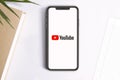 Smartphone showing the youtube logo on its screen. Empty copy space