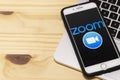 Smartphone showing Zoom Cloud meetings application logo on an a screen