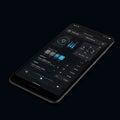 Smartphone with a sleek user interface displaying various controls and graphs. Royalty Free Stock Photo