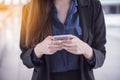 On smartphone. Smiling face of asian woman holding cellphone with E-commerce Shopping online website Reading Online Article, Blog Royalty Free Stock Photo