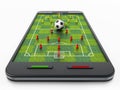 Smartphone with soccer field, football and pawns. 3D Royalty Free Stock Photo